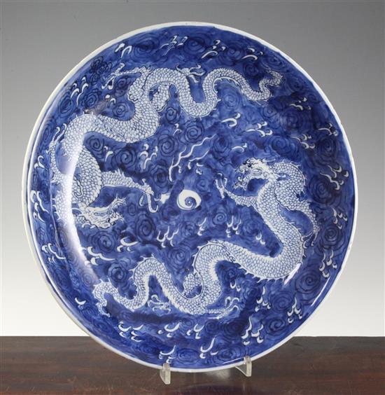 A Chinese blue and white dragon dish, Kangxi period, 34.5cm